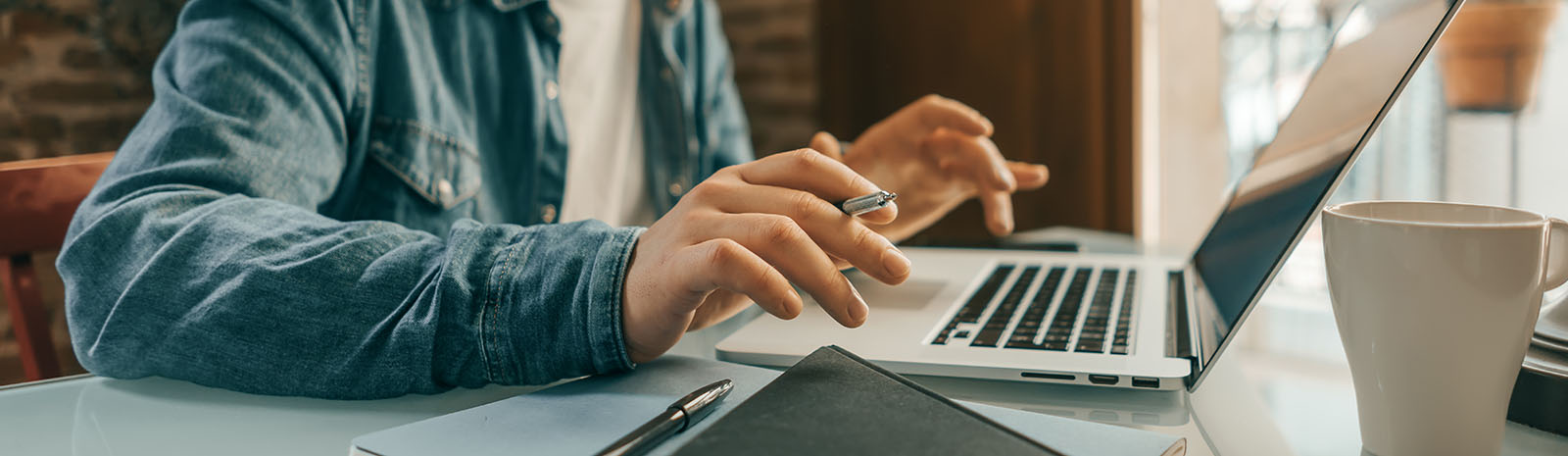 man at desk working on laptop