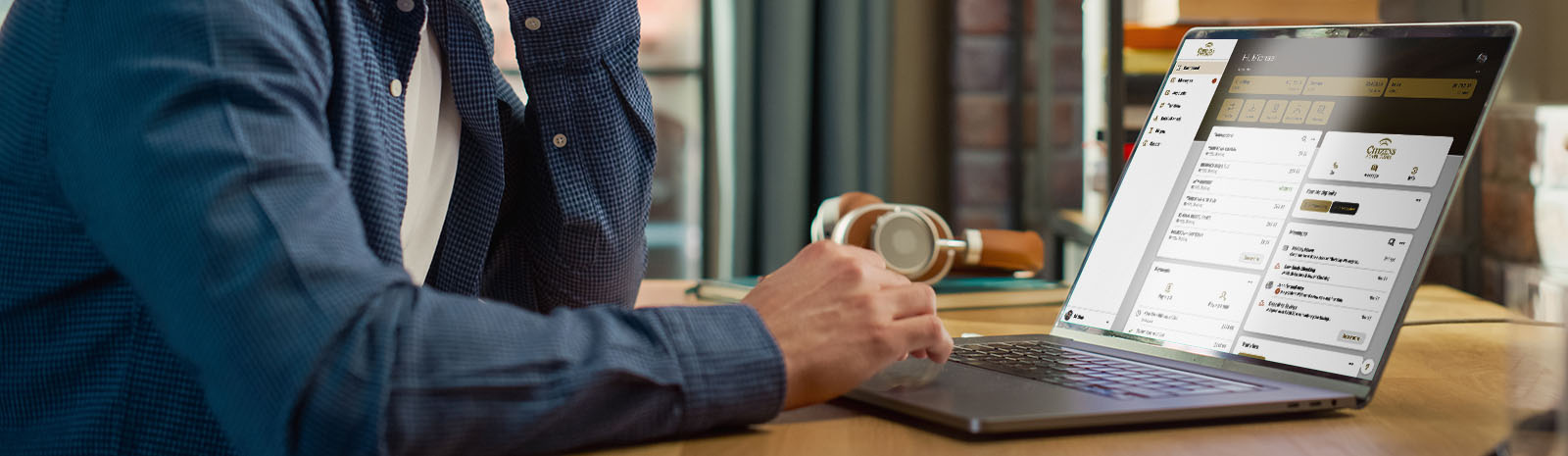 Man using CSB online banking on laptop at desk