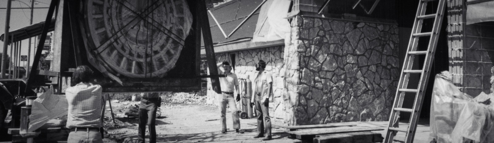 Men moving vault door with crane to new location of Citizens State Bank, Gridley, Kansas